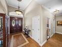 Elegant entryway with hardwood floors and double doors at 465 Rowland Ct, Bartow, FL 33830