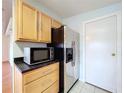 Kitchen featuring wooden cabinets and stainless steel appliances at 470 Village Sw Cir, Winter Haven, FL 33880