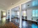 Inviting dining area with hardwood floors, neutral paint, and sunlit windows enhancing the bright space at 105 Old Connersville Rd, Bartow, FL 33830