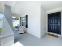 Inviting front porch with seating area and a welcoming entrance at 1205 Third Ct, Eagle Lake, FL 33839