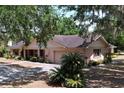 Inviting single-story home with lush landscaping, attached garage and charming curb appeal at 1600 Alma Ct, Bartow, FL 33830