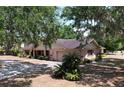 Inviting single-story home with lush landscaping, attached garage and charming curb appeal at 1600 Alma Ct, Bartow, FL 33830