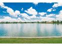 Scenic lake view showcasing the expansive water and clear blue sky, with trees lining the horizon at 1920 E Edgewood Dr # D7, Lakeland, FL 33803