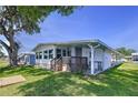 Inviting home with a covered patio, carport and well-manicured lawn, perfect for relaxed outdoor living at 2055 S Floral Ave # 291, Bartow, FL 33830