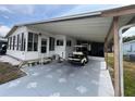 Cozy home with convenient carport offering covered parking and easy access, enhancing the property's appeal at 2055 S Floral Ave # 45, Bartow, FL 33830