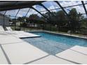 Inviting screened pool with attached spa and ample deck space, perfect for outdoor entertaining and enjoying the sun at 2742 Pine Acres Dr, Lake Wales, FL 33898
