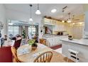 Open kitchen boasts a breakfast nook and seamless flow to the living areas at 3154 Prairie Dunes W Cir, Lakeland, FL 33810