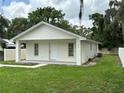 A cozy single-story home with a small porch and a well-kept lawn in a fenced yard at 340 W Stanford St, Bartow, FL 33830