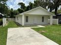 A charming single-story home with a covered porch and a spacious driveway at 340 W Stanford St, Bartow, FL 33830