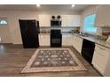 Well-lit kitchen featuring modern appliances and a stylish decorative rug at 4140 Old Dixie Hwy, Auburndale, FL 33823