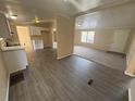 Open-concept kitchen and living room with new flooring and ample natural light at 5138 Rock Dove Trl, Lakeland, FL 33810