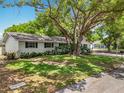 Picture of a lovely single Gathering home with a brick exterior with shade trees and a green lawn at 603 Solana St, Lakeland, FL 33813