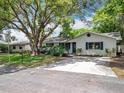 Lovely single Gathering home with lush green lawn and mature trees providing ample shade at 603 Solana St, Lakeland, FL 33813