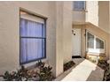 Inviting front entrance with a white door and stylish architectural window detail at 804 Magnolia Pl # 804, Winter Haven, FL 33884