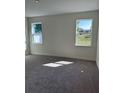 Sunlit bedroom with neutral carpet and a view to the exterior at 6107 Sw 115Th Street Rd, Ocala, FL 34476