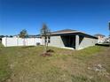 The house includes a well-kept lawn, a fenced-in yard and a covered patio to enjoy backyard cookouts at 2366 Aquiline Nest St, Eagle Lake, FL 33839