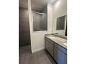 Elegant bathroom with double vanity, modern fixtures, and a glass-enclosed shower at 10776 Sw 49Th Ave, Ocala, FL 34476