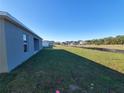 Expansive backyard with lush green grass, perfect for outdoor activities and relaxation at 2408 Nw 22Nd Ct, Ocala, FL 34475