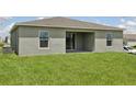 The home has a simple backyard with a blank canvas that is awaiting your custom design at 4323 Periwinkle Pl, Lake Hamilton, FL 33851