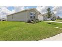 Charming one-story home featuring a well-manicured lawn and inviting curb appeal at 4323 Periwinkle Pl, Lake Hamilton, FL 33851