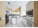 Kitchen with stainless steel appliances and white cabinets at 388 Hampton Hills Ct, Debary, FL 32713