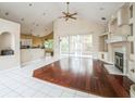 Living room with hardwood floors and a fireplace at 388 Hampton Hills Ct, Debary, FL 32713