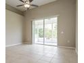 Spacious bedroom with tile floors and sliding glass doors to patio at 5634 Moon Valley Dr, Lakeland, FL 33812