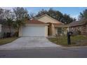 House exterior showcasing a driveway and front yard at 2325 Paulette Dr, Haines City, FL 33844