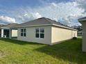 Backyard view featuring a well-maintained lawn at 999 Brooklet Dr, Davenport, FL 33837