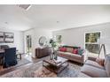 Open-concept living room with hardwood floors, two couches, and lots of natural light at 540 Glade Ct, Kissimmee, FL 34758