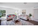 Inviting living room with natural light, two sofas, and stylish decor for comfortable living at 540 Glade Ct, Kissimmee, FL 34758