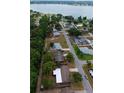 Aerial view showcasing the property's proximity to the lake and lush green surroundings at 5801 Poinciana Ave, Lakeland, FL 33809