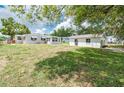 Expansive backyard featuring the house and the shed providing lots of room for outdoor activities at 760 Formosa Ave, Bartow, FL 33830
