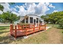 Inviting home exterior showcasing a lovely wooden deck, ideal for enjoying the outdoors and entertaining at 760 Formosa Ave, Bartow, FL 33830