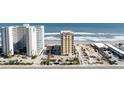 Residential condo buildings with parking and ocean views from street level at 2071 S Atlantic Ave # 201, Daytona Beach Shores, FL 32118