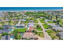 Expansive aerial view showcasing a lovely single Gathering home with a pool and close proximity to beach at 3 Seabridge Dr, Ormond Beach, FL 32176
