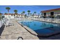 Community pool features a large sundeck with lounge chairs and scenic views of surrounding properties at 64 Ocean Palm S Dr # 64, Flagler Beach, FL 32136