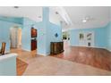 Open living area with light blue walls and wood flooring at 928 George Hecker Dr, South Daytona, FL 32119