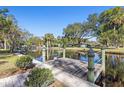 Wooden dock with scenic canal views at 1069 Indigo Rd, Ormond Beach, FL 32174