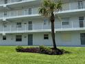 Sunrise Condominiums with well maintained landscape of shrubbery and palm tree at 2294 Ocean Shore Blvd # 1020, Ormond Beach, FL 32176