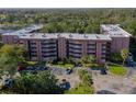 Aerial view of Tomoka Oakwood North condos, showing building and parking lot at 640 N Nova Rd # 212, Ormond Beach, FL 32174
