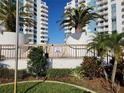 Condominium buildings surrounded by lush tropical landscaping, providing a welcoming and aesthetically pleasing environment at 935 N Halifax Ave # 602, Daytona Beach, FL 32118