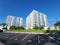 Condominium buildings feature multiple balconies, parking and green spaces, creating a vibrant and convenient living environment at 935 N Halifax Ave # 602, Daytona Beach, FL 32118