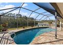 Relaxing screened pool area with lake views at 10 Ocean Pines Dr, Ormond Beach, FL 32174