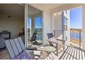 Balcony with lake view and patio furniture at 3161 Paradox Cir # 303, Kissimmee, FL 34746