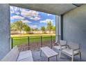 Spacious patio overlooking grassy area, ideal for outdoor enjoyment at 4741 Clock Tower Dr # 105, Kissimmee, FL 34746