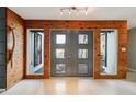 Modern front door with wood and glass panels at 6 Baytree Cir, Ormond Beach, FL 32176