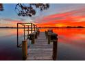 Serene waterfront property with a private dock at sunset at 2627 John Anderson Dr, Ormond Beach, FL 32176