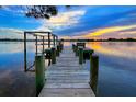 Peaceful waterfront dock perfect for enjoying sunsets at 2627 John Anderson Dr, Ormond Beach, FL 32176