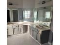 Large bathroom with double vanity, corner sink, and marble floors at 130 Prima Dr, Kissimmee, FL 34759